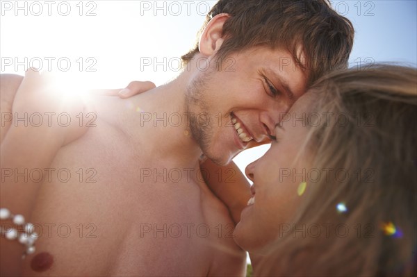 Young couple hugging on beach. Date : 2008