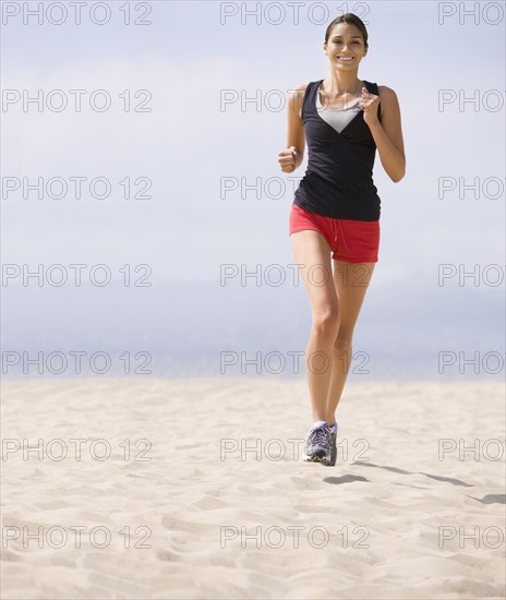 Woman running on beach. Date : 2008