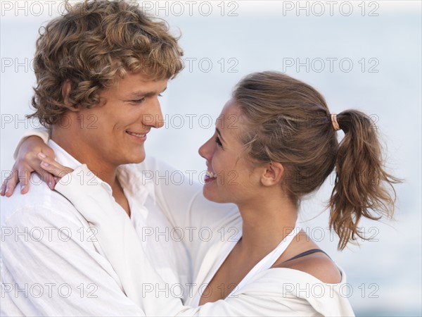 Young couple hugging on beach. Date : 2008