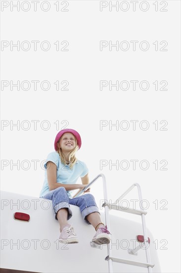 Girl sitting on top of motor home. Date : 2008