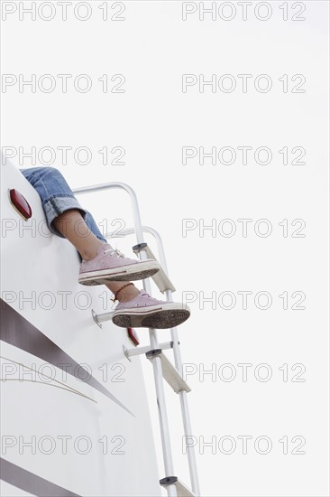 Girl sitting on top of motor home. Date : 2008