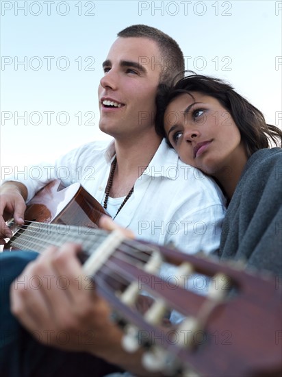 Young couple relaxing on beach. Date : 2008