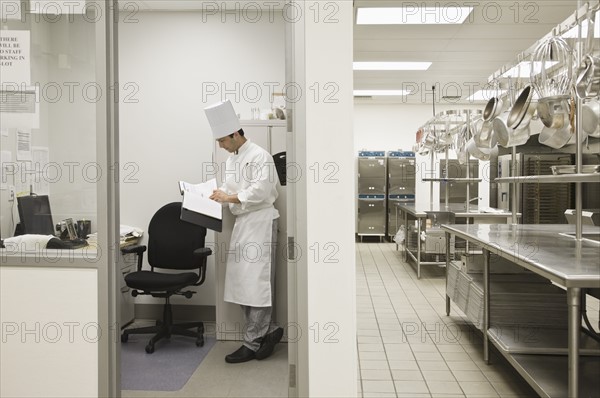 Head chef standing in kitchen office. Date : 2008