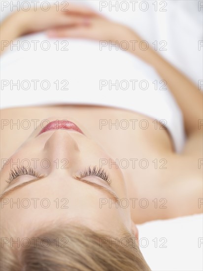 Young woman lying down in massage table. Date : 2008