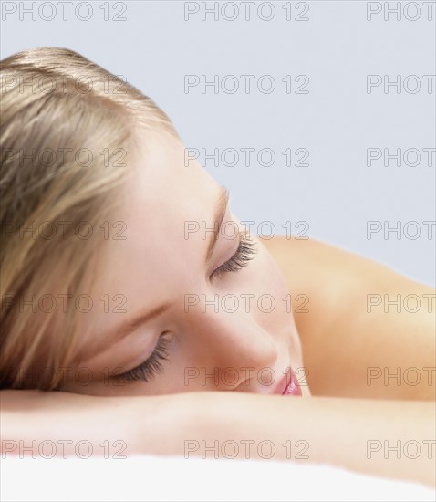 Young woman lying down in massage table. Date : 2008