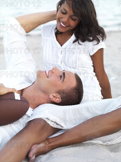 Young couple relaxing on beach. Date : 2008