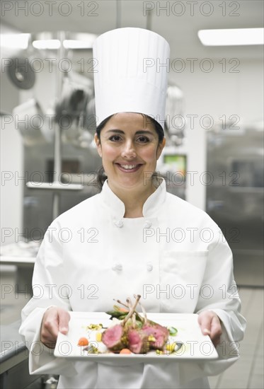 Chef presenting gourmet entree. Date : 2008