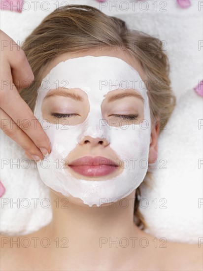 Young woman getting facial spa treatment. Date : 2008