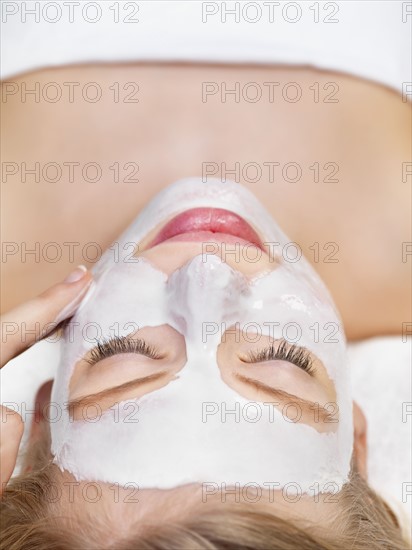 Young woman getting facial spa treatment. Date : 2008