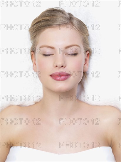 Young woman lying down on massage table. Date : 2008