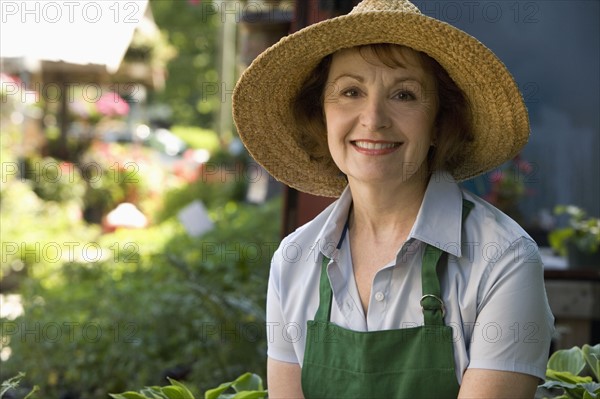 Woman working in garden center. Date : 2008