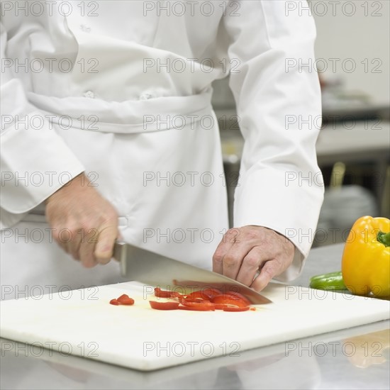 Chef chopping bell peppers. Date : 2008