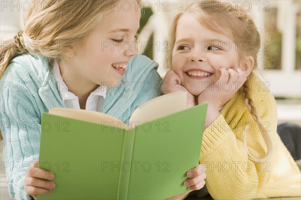 Sisters reading on porch. Date : 2008