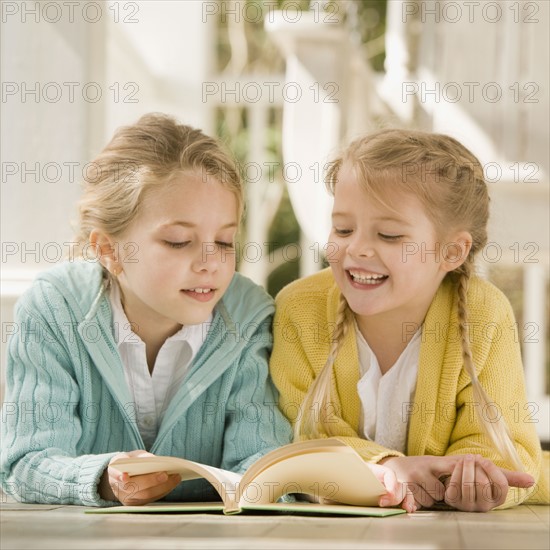 Sisters reading on porch. Date : 2008