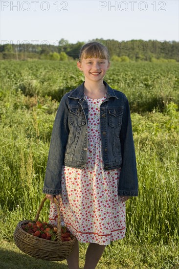 Girl picking strawberries. Date : 2008