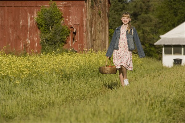 Girl picking strawberries. Date : 2008