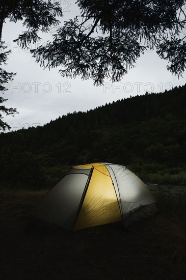 Tent illuminated at night. Date : 2008