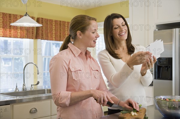 Friends preparing dinner. Date : 2008