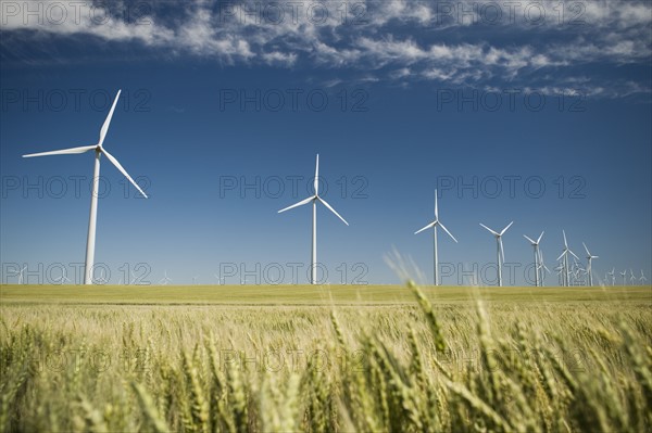 Windmills in a row on wind farm. Date : 2008