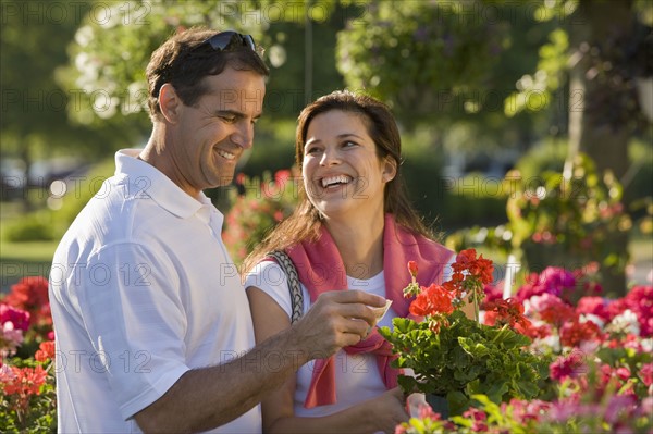 Couple shopping for flowers. Date : 2008