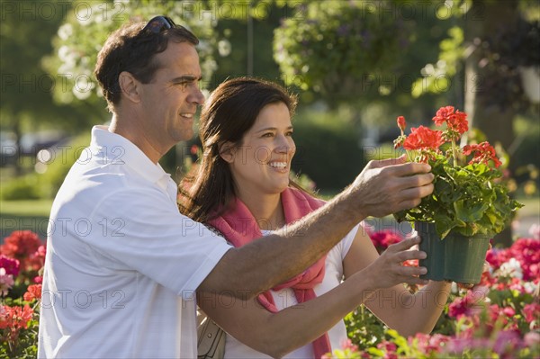 Couple shopping for flowers. Date : 2008