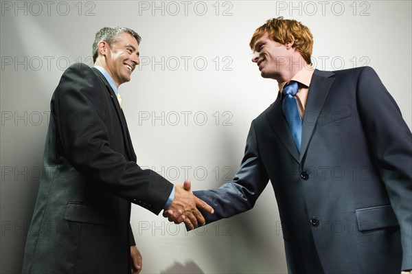 Businessmen shaking hands. Date : 2008