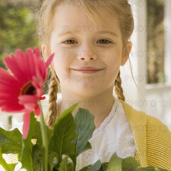 Girl holding flower. Date : 2008