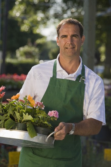 Man working in garden center. Date : 2008