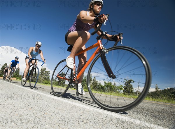 Cyclists in a row on mountain road. Date : 2008