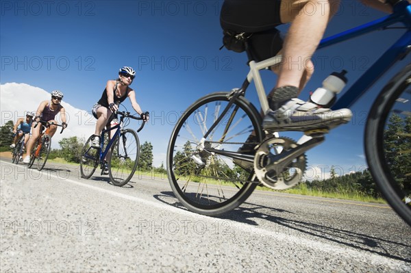 Cyclists in a row on mountain road. Date : 2008