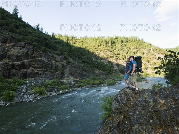 Hikers admiring view of river. Date : 2008