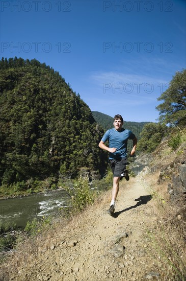 Man running on riverside trail. Date : 2008