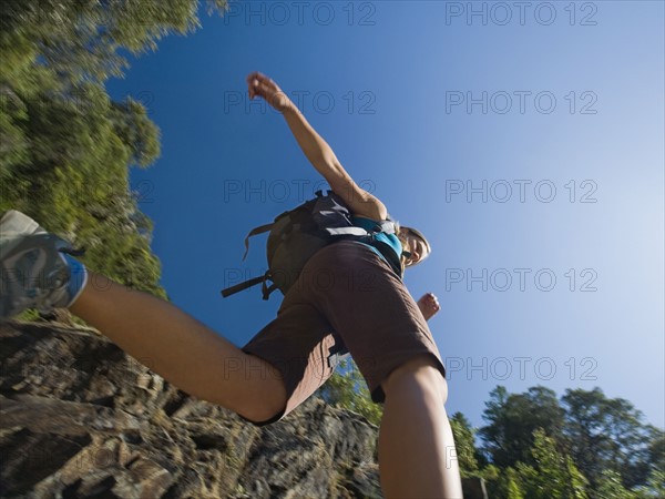 Low angle view of female hiker. Date : 2008