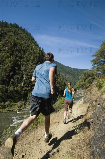 Runners on riverside trail. Date : 2008