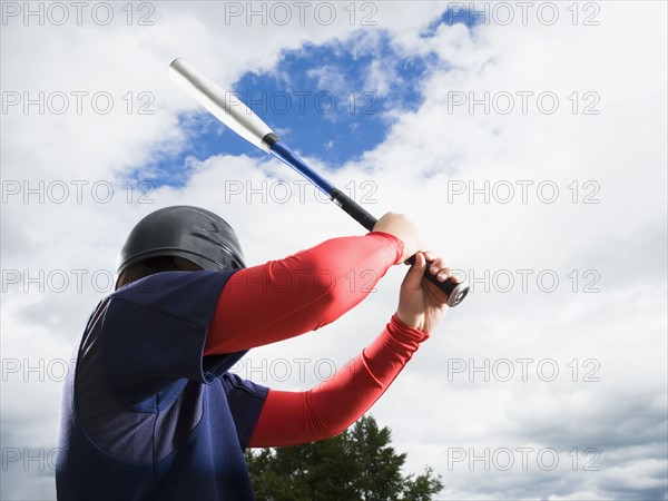 Baseball player reading to swing bat. Date : 2008