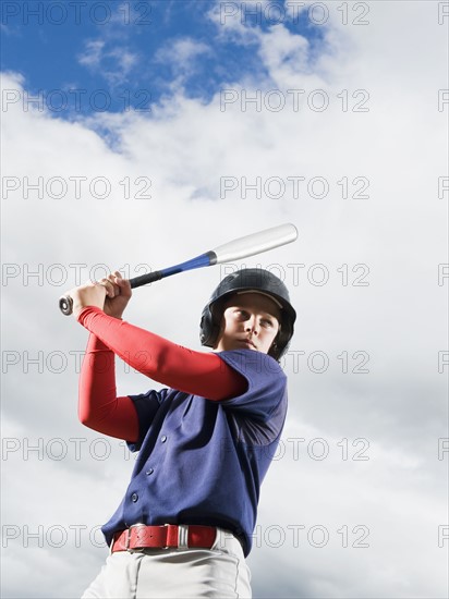 Baseball player reading to swing bat. Date : 2008