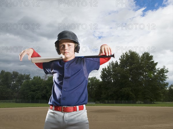 Baseball player posing with bat. Date : 2008