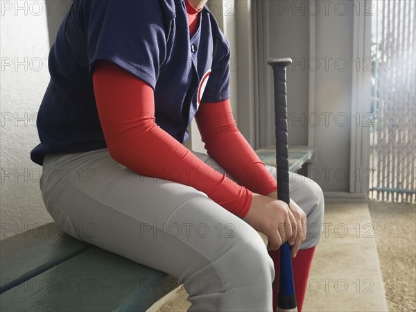 Baseball player sitting in dugout. Date : 2008