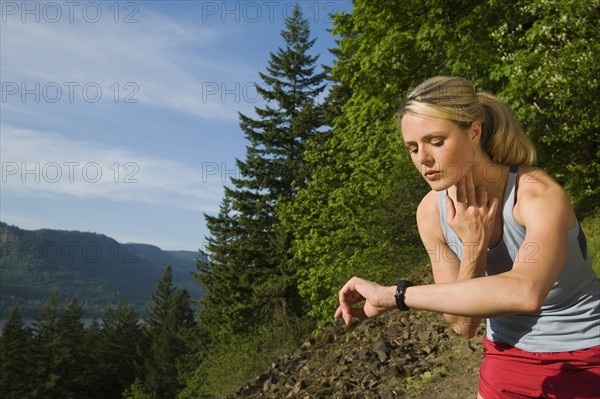 Runner checking heart rate. Date : 2008