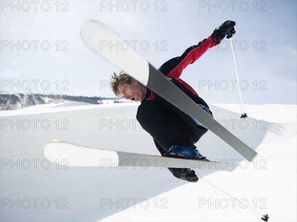 Skier jumping off lip of half-pipe. Date : 2008