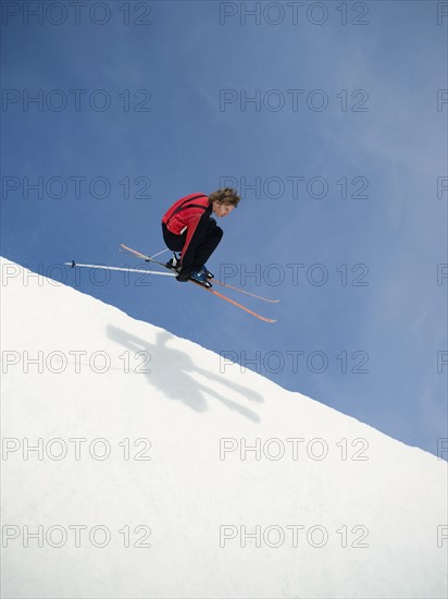 Skier jumping off lip of half-pipe. Date : 2008