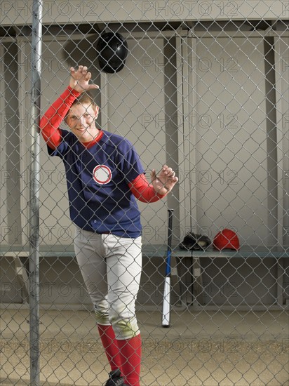 Baseball player standing in dugout. Date : 2008