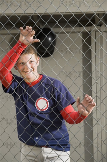 Baseball player standing in dugout. Date : 2008