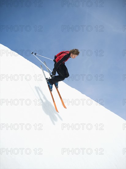 Skier dropping in to half-pipe. Date : 2008