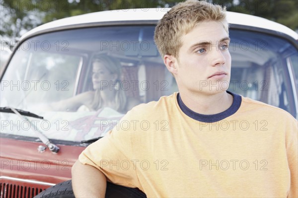 Young man leaning on van. Date : 2008