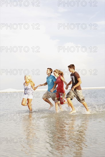 Friends running in ocean. Date : 2008