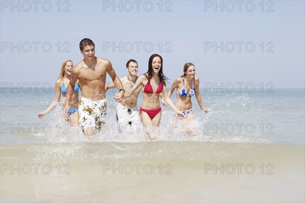 Friends walking in ocean. Date : 2008