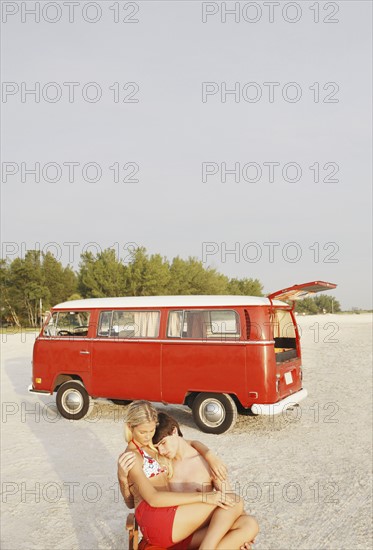 Young couple hugging on beach. Date : 2008