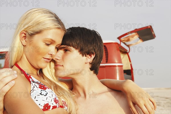 Young couple hugging on beach. Date : 2008