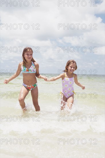 Girls running in ocean. Date : 2008